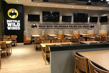 Dining area at Buffalo Wild Wings, Muscat-Oman designed by Professional Interior Decorators in Dubai UAE